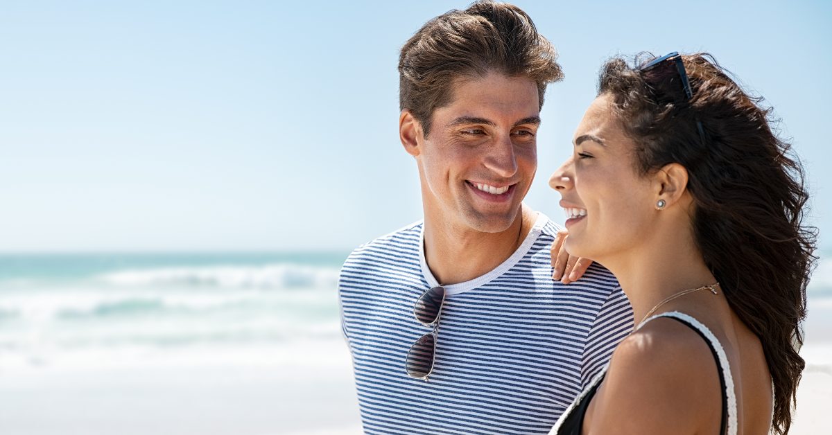 Couple smiling at beach